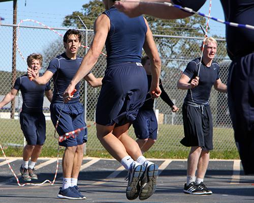 Junior Cody Vicknair and sophomores Michael Hilston and Michael Smith on Jan. 29 during the jump rope station of bootcamp.