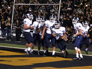 Junior Cody Vicknair celebrates with his teammates in the end zone.