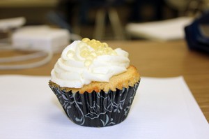 Andie OBriens pineapple upside down cupcake with rum and coconut frosting and honey pearls.