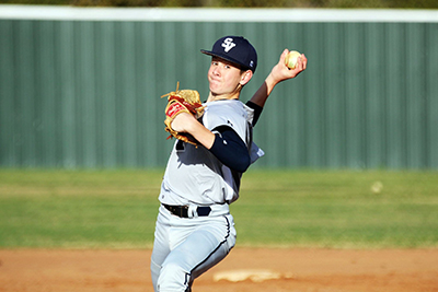 Freshman Colton Eilers pitches the ball on Feb. 23.