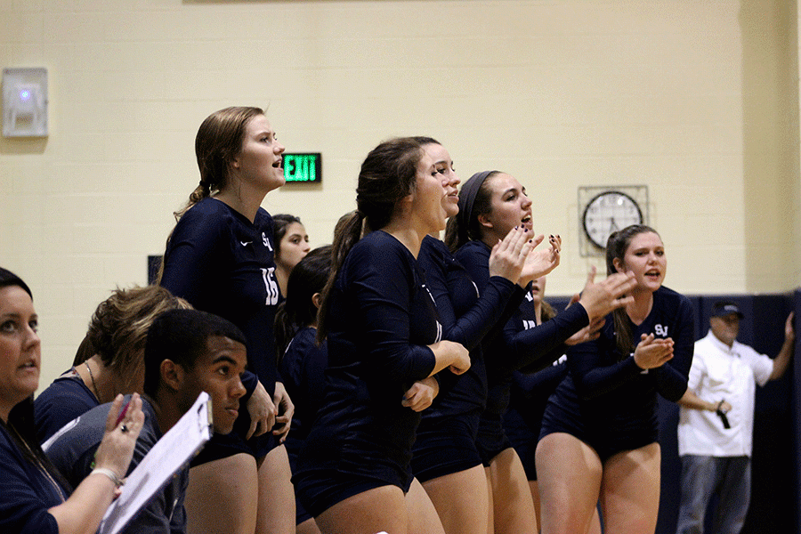 The volleyball team cheers on Oct. 23 during a game against New Braunfels. 