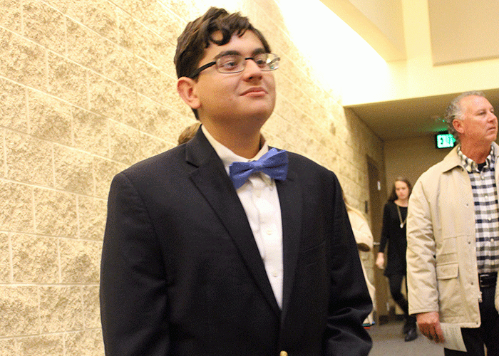 Junior David Richison stands proudly waiting for his name to be called on Jan. 11 during the NHS induction. 