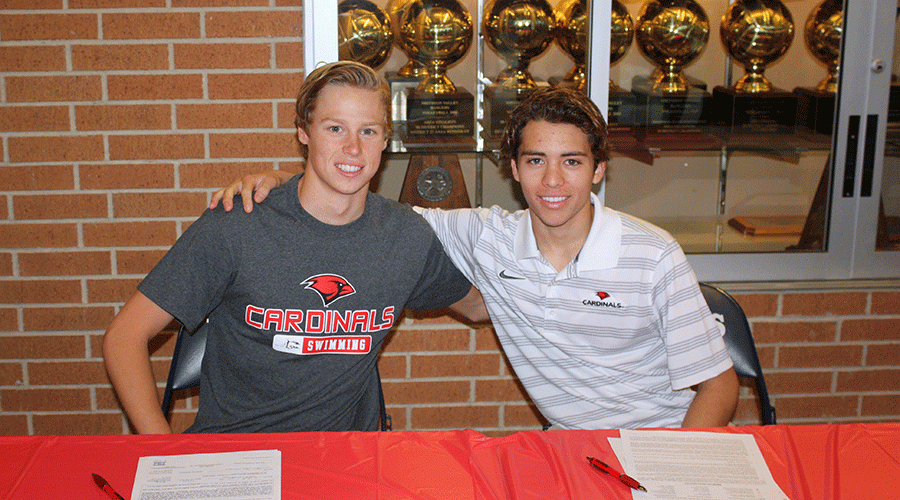 Senior Clayton Taylor and Dawson Martinez smile after signing their letters of intent to Incarnate Word.