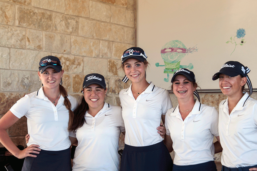 The girls golf team stands together after the district tournament. 