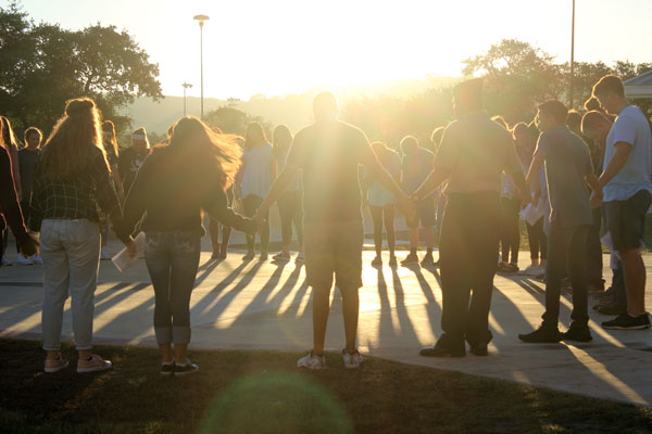 Students and staff gather for the early morning celebration of See You at the Pole on Sept. 28.