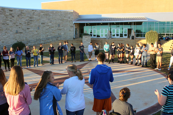 See You at the Pole participants clap their hands in time with the music on Sept. 28.