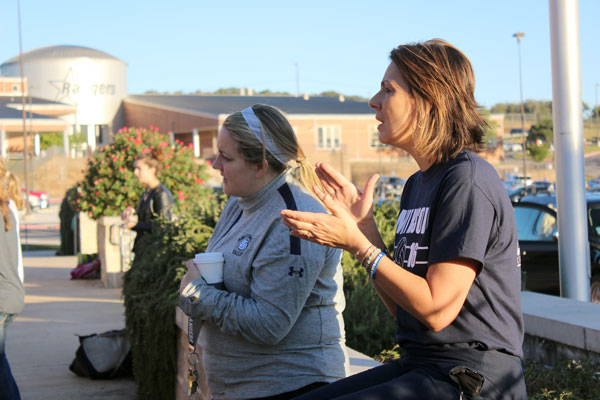 Coach Jordan Madill and Coach Liana Gombert participate in See You at the Pole Sept. 28.