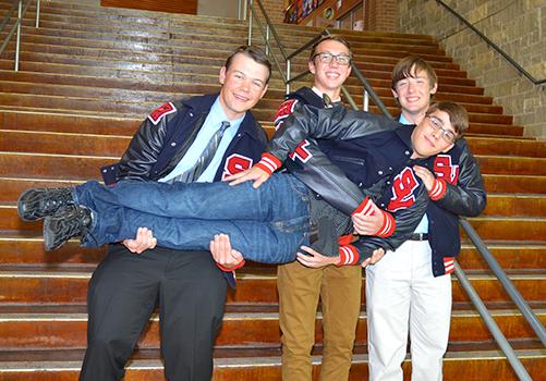   The National Merit Semifinalists Jared Pauletti,  Donald Snodgrass and Jacob Foster lift Tony Perez. The school had four of the six National Merit Semifinalists in the district. 