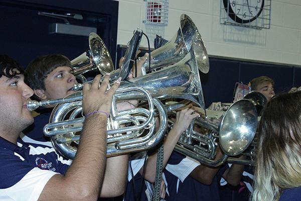 The baritone section performs with the band during the Pink Out pep rally Oct. 21.
