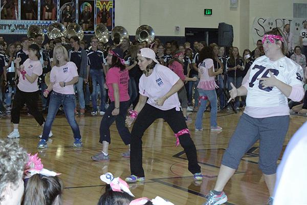 Staff members Denise Nipper, Stephanie Kirkpatrick, Kathryn Rutledge, Laura Heldmann and Amanda Trussell show off their moves in the teacher dance. 