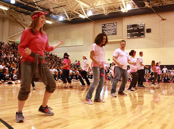 Teachers Christine OBryant, Michelle Price, Jonathan McKinley, Thelma Garza and Chris Helkey dance during the pep rally.