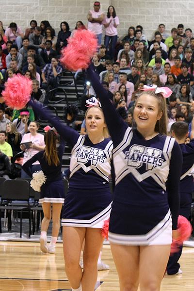 Cheerleaders get their pompoms into pumping up the crowd.