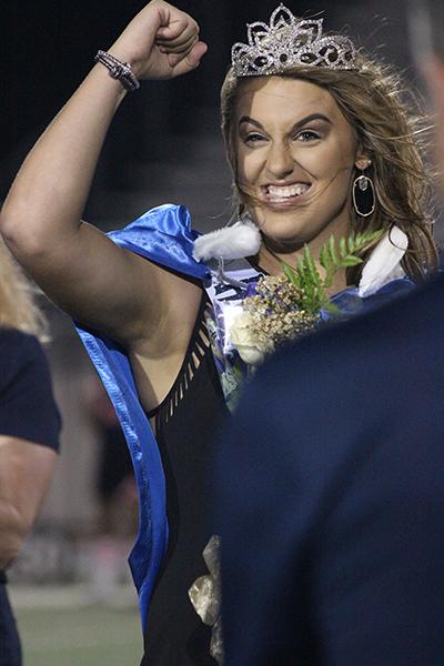 Homecoming queen Taylor Mooney celebrates winning the coveted crown.