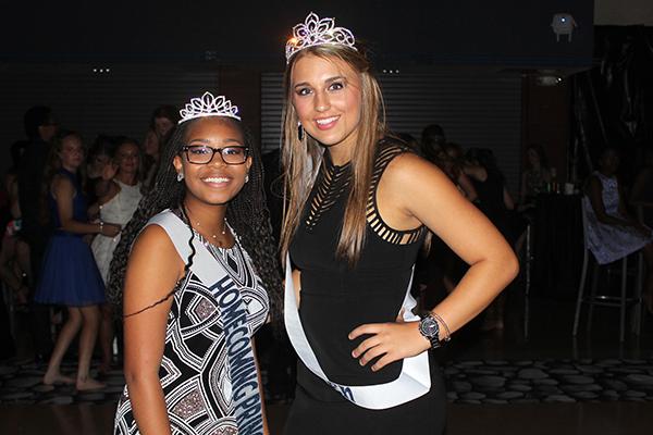 Freshman princess Madilyn Lerow and homecoming queen Taylor Mooney celebrate their wins.