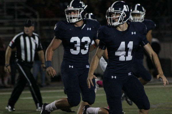 Senior Jack Gibbens and junior Jacob Zuber get into position during the Oct. 7 homecoming win of 37-0 over Wagner.