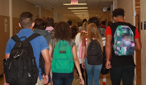Students walk down the main A-wing hallway on their way to first period. The increase in student population led to crowding in the hallways.