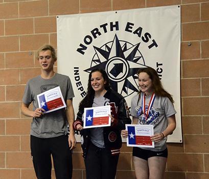 Sophomore Konnar Klinksiek and junior Caitie Mansker receive their swimmer of the meet awards. 
