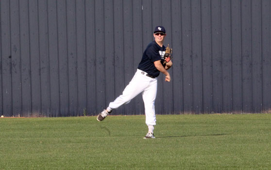 Senior outfielder David Grochett throws a ball from the outfield during the teams practice on Feb 26. at Smithson Valley