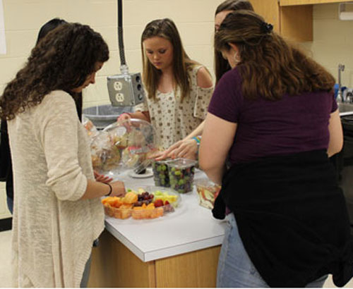 FACS members prepare food for the 150 student who participated in the 30 hour famine two years ago. Students went hungry for 30 hours to raise awareness for the people around the world who are starving and may not eat once on any day. This tradition lives on years later. 