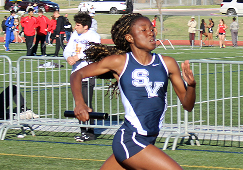 Jane Uduji competes in a sprint at the Tiger Relays in Dripping Springs Feb. 25.
