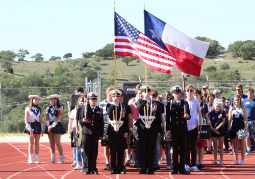 The NJROTC color guard presents the flags before the Star track meet Thursday.