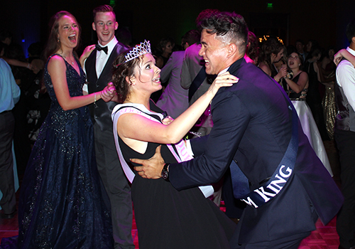 Senior Josh Adkins dips senior Ann Mark during the Prom King and Queen dance.