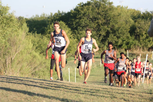 Leading the pack: Clayton Wilkerson and Andres Engle lead the pack at the NEISD Cross Country meet on Sept. 9. The boys team would go on to take first place in the meet.