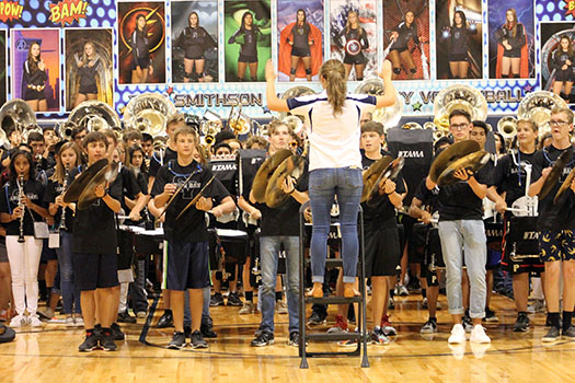 Drum Major Ann Mark conducts the band performance during the pep rally last year. 