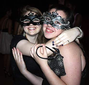 Sophomore Julia Deemer and junior Alyssa Tarabay pose for the camera at the dance.