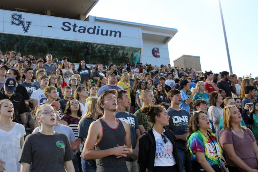  Hundreds of students rejoice in song together. A guest band played for the parents, faculty, and students that attended during Fields of Faith Oct. 4.