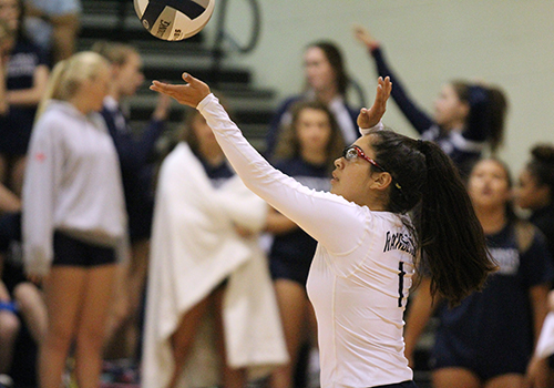 Gabi Sandoval serves ball to the other side of the court.