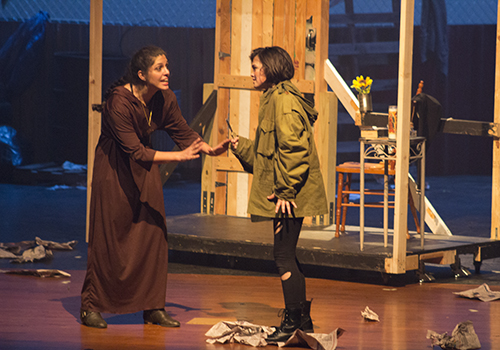 Giselle Kowalski as Friar Lawrence tries to calm Kaylee Underwood as Juliet.