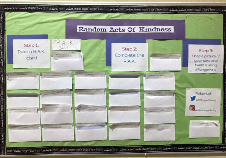 Random acts of kindness board is located outside the campus library.