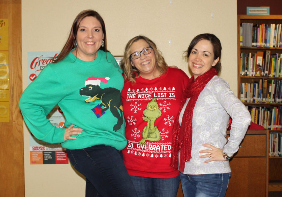 Librarian Amanda Trussell, American Sign Language teacher Claudia Barthuly, and librarian Thelma Garcia pose in with Christmas pride in the library Thursday, Dec. 6.