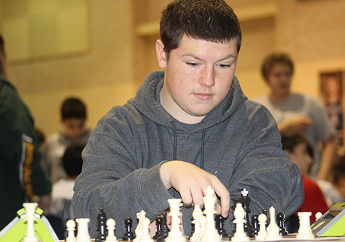 Sixth place overall winner junior Gage Clark prepares to make a fatal move against his opponent, during the Comal Isd Chess tournament on campus last Saturday. The next tournament will be held in Canyon on March 24.  