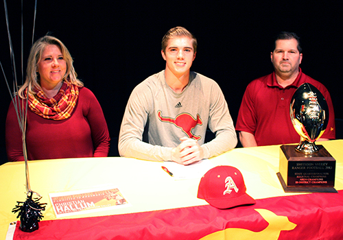 Christian Hallum sits in between his parents at his signing to Austin College. He will play football there. It felt like it fit, he said. I liked what the program and coaches stood for. I can see myself there.