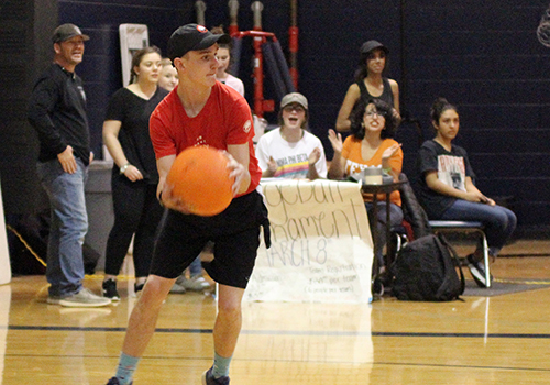 Junior Liam Weeks takes aim during the annual dodgeball tournament Thursday.