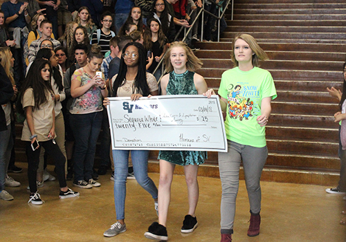 Humans of SV representatives present Sequoia White and the Leukemia Lymphoma Society with a donation of $25.
