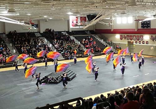 The guard colorfully performs at the Austin WGI Competition.