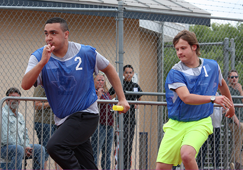 Grant Turner passes the baton to Sean McNeal during the STAR track meet on April 27.