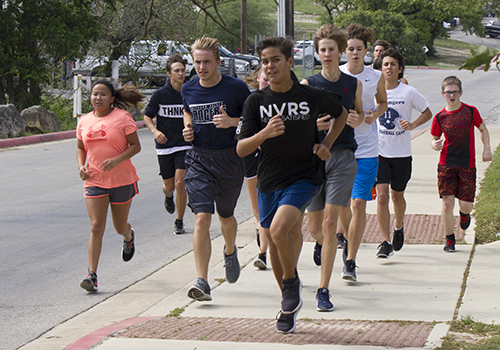 The 7th period swim class run a lap around the campus for an off season on April 5.