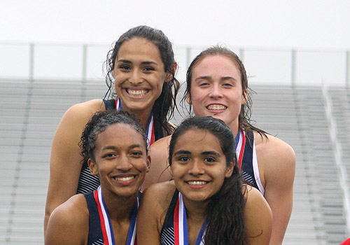 The girls 4X400 relay team of sophomore Jezell Shows, freshman Carmen White, senior Frida Sanchez and freshman Amalie Mills won the district crown Friday. They received these medals for their first place finish at the Ranger Relays.