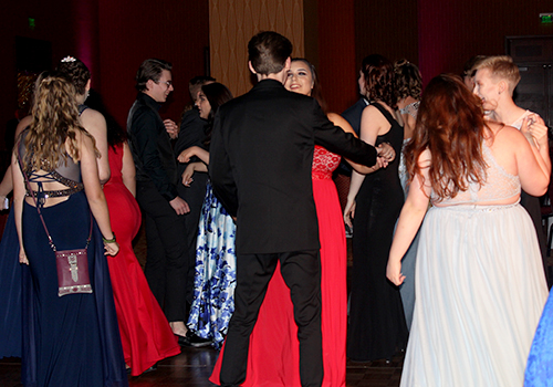 The dance floor at prom quickly filled with student eager to dance.