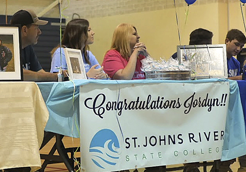 Waiting with her parents, senior Jordyn Pruski prepares with sign her letter of intent to play volleyball at St. Johns River.
