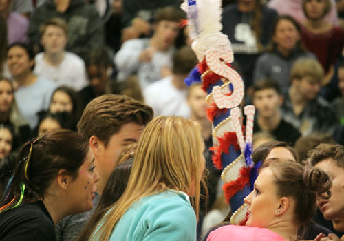 Charged with judging which class has the most spirit, the judges confer to give the spirit stick to the juniors.