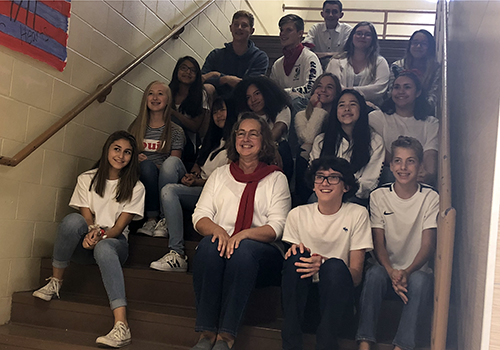 Madame Leighanne Hinsch’s sixth period French class
celebrates after HInsch gave those who participated in spirit week five point extra credit on a quiz. She had the students dress up in colors from the flag of France.
