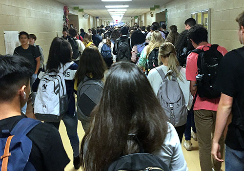 Students pack the hallway during passing period in upstairs B-Wing as they mosey down to their next class.