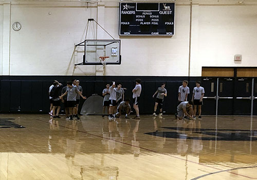 Cold and rainy weather causes the 7th period soccer to continue their practice inside the gym.