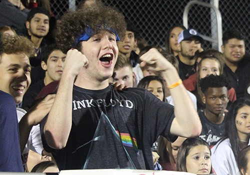 In the midst of the student section, junior Ewan Salter cheers Nov. 2 during the San Marcos football game.
