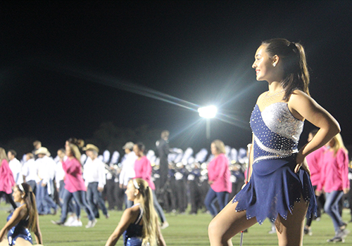 While the Silverados dance with their moms at halftime Nov. 2, freshman Lauren Matula awaits the bands performance.